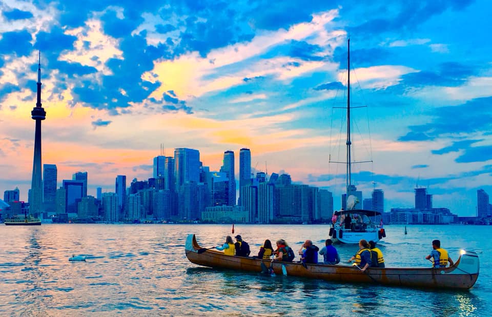sunset canoe activities at toronto harbour is a part of canadian cultural activity for tourists visiting the city