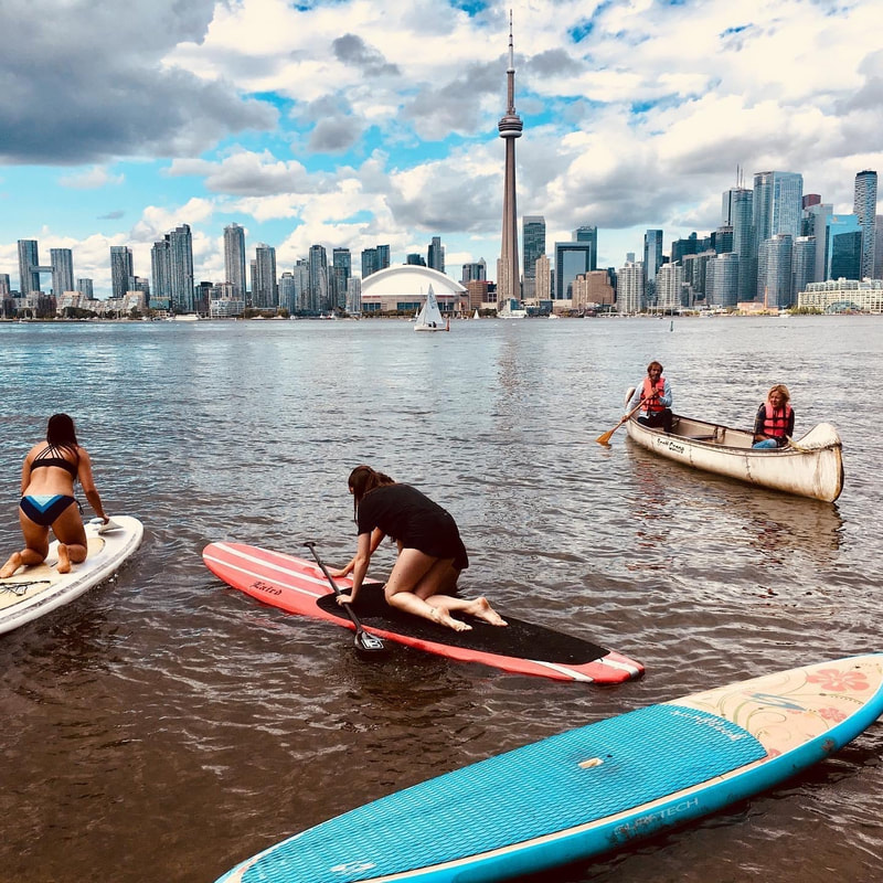 Learning sup in toronto is easy thanks to calm waters and shallow beaches.  and the city provides a perfect background for Instagramable photos.