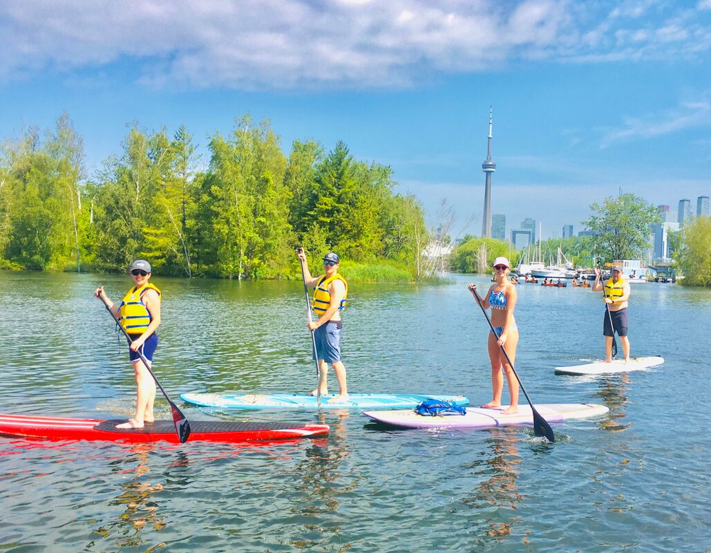when paddling in a group with an instructor exploring toronto and the toronto harbour.  beginner lessons and instructions for those who want to learn sup paddle boarding in toronto. paddle canada certified